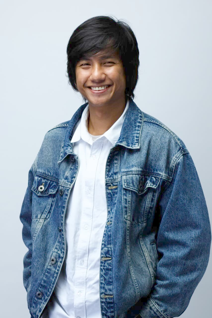William Orchard, post-production editor and AI production lead, in a denim jacket